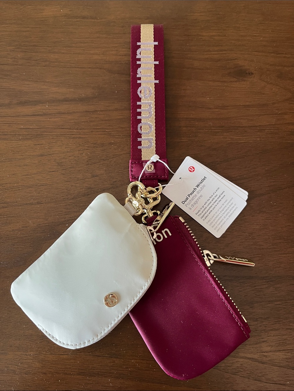 lululemon athletica Dual Pouch Wristlet in Cream and Burgundy with Branded Strap